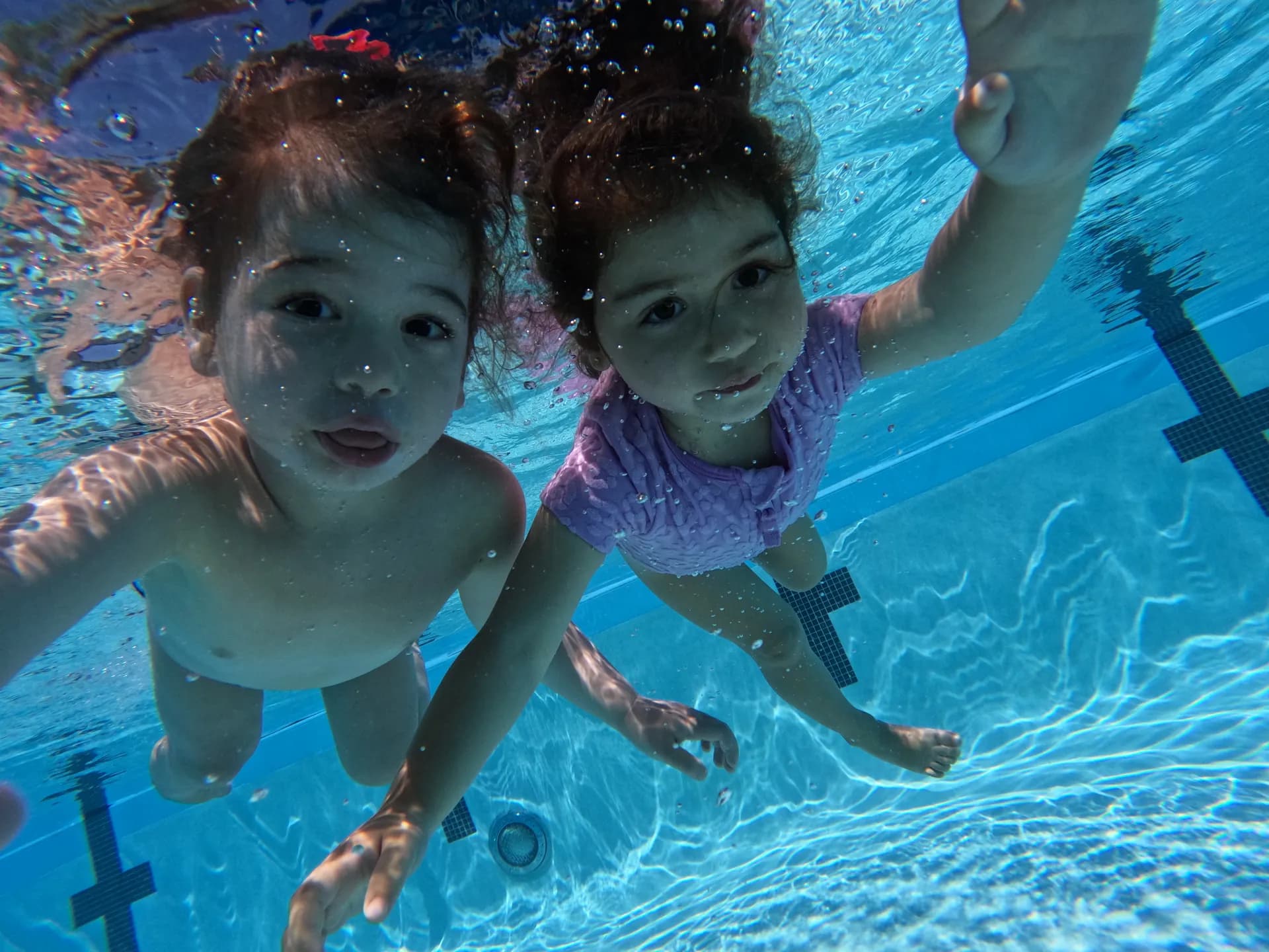 Happy children swimming